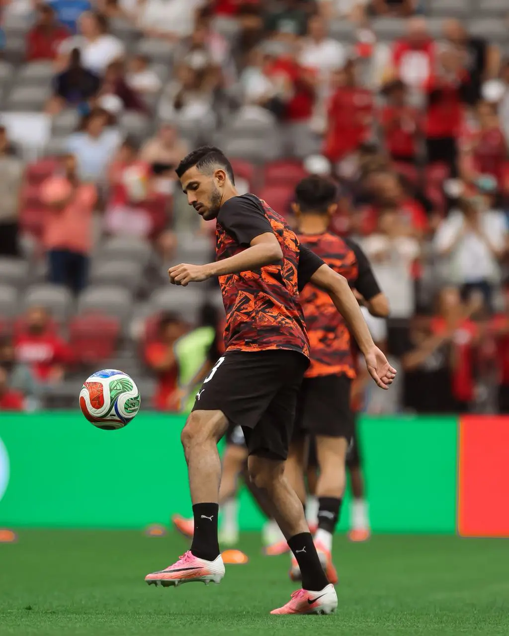 بالصور.. لاعبو منتخب مصر يجرون عمليات الإحماء استعدادًا لمواجهة نيوزيلندا